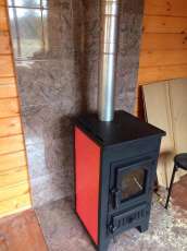 Купить стальной камин Везувий ПК-01 (270) в Барановичах фото в интерьере в Барановичах