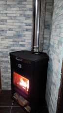 Стальной недорогой камин Теплодар ОВ-120 (угловой) фото в интерьере в Барановичах