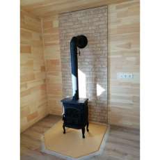 Чугунный камин со стеклом Сибирь 7 фото в интерьере в Барановичах