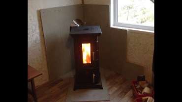 Отопительная печь Термофор Статика Тетра, чёрная бронза фото в интерьере в Барановичах