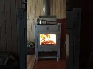 Стальной камин со стеклом Теплодар Кадриль фото в интерьере в Барановичах