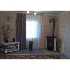 Стальной камин с шамотом Мета-Бел Ритм L фото в интерьере в Барановичах