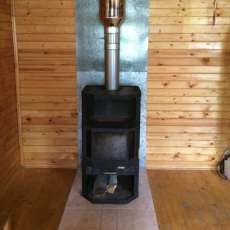 Печь-камин с шамотом Мета-Бел Ангара-Аква в интерьере фото в Барановичах