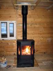 Печь-камин Бавария водяной с плитой в интерьере в Барановичах