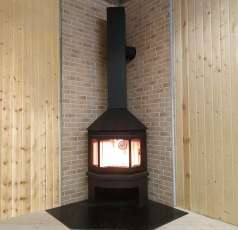 Стальной камин Бавария Мюнхен угловой чёрный (без перемычки) фото в интерьере в Барановичах