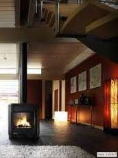 Печь-камин чугунный Invicta Carolo в интерьере Амазонка бай фото  в Барановичах