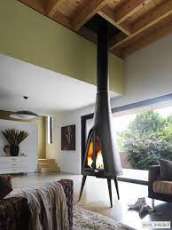 Печь-камин чугунный Invicta Pow-Wow в интерьере Амазонка бай фото в Барановичах