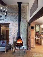 Печь-камин чугунный Invicta Pow-Wow в интерьере Амазонка бай фото в Барановичах