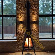 Печь-камин чугунный Invicta Pow-Wow в интерьере Амазонка бай фото в Барановичах